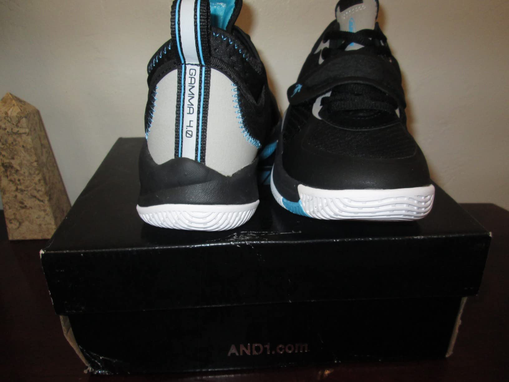 AND1 basketball shoes design detail showing reinforced strap closure and ankle support features