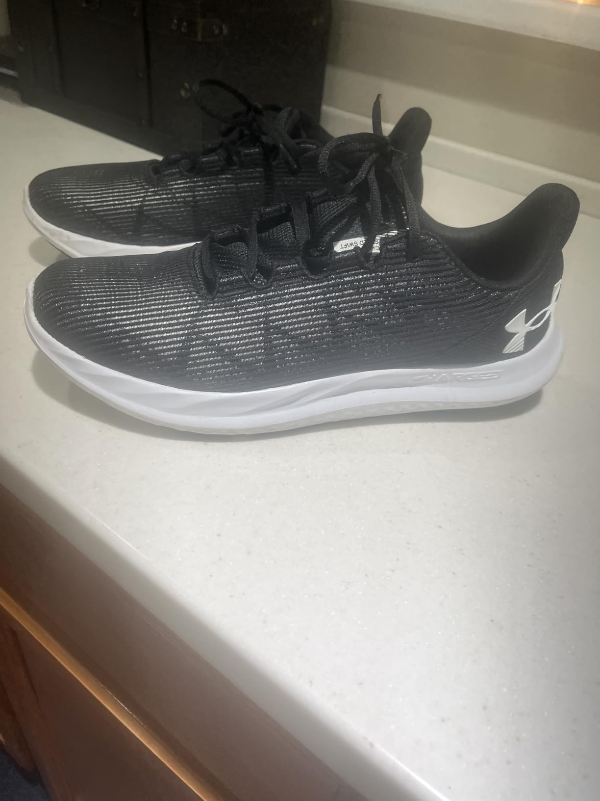 Under Armour Men's Charged Speed Swift sneaker white and gray colorway showing mesh upper and charged cushioning sole