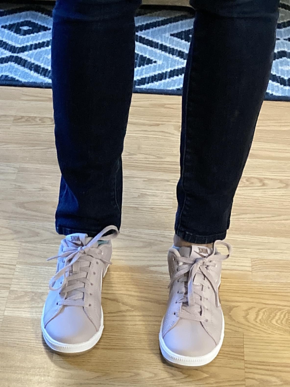 Nike Women's Court Borough Low basketball shoes cream white colorway showing classic leather construction and clean lines