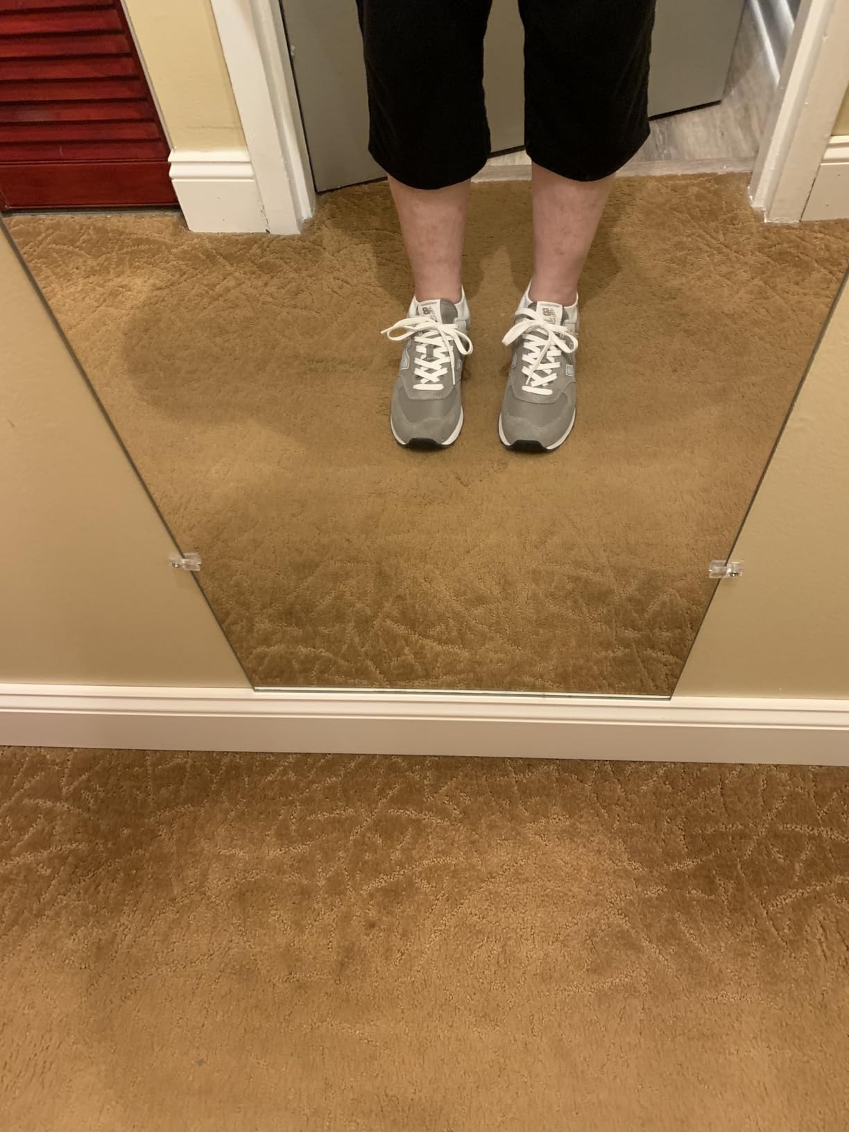 New Balance Women's 574 Core Sneaker in gray and white colorway showing classic retro design