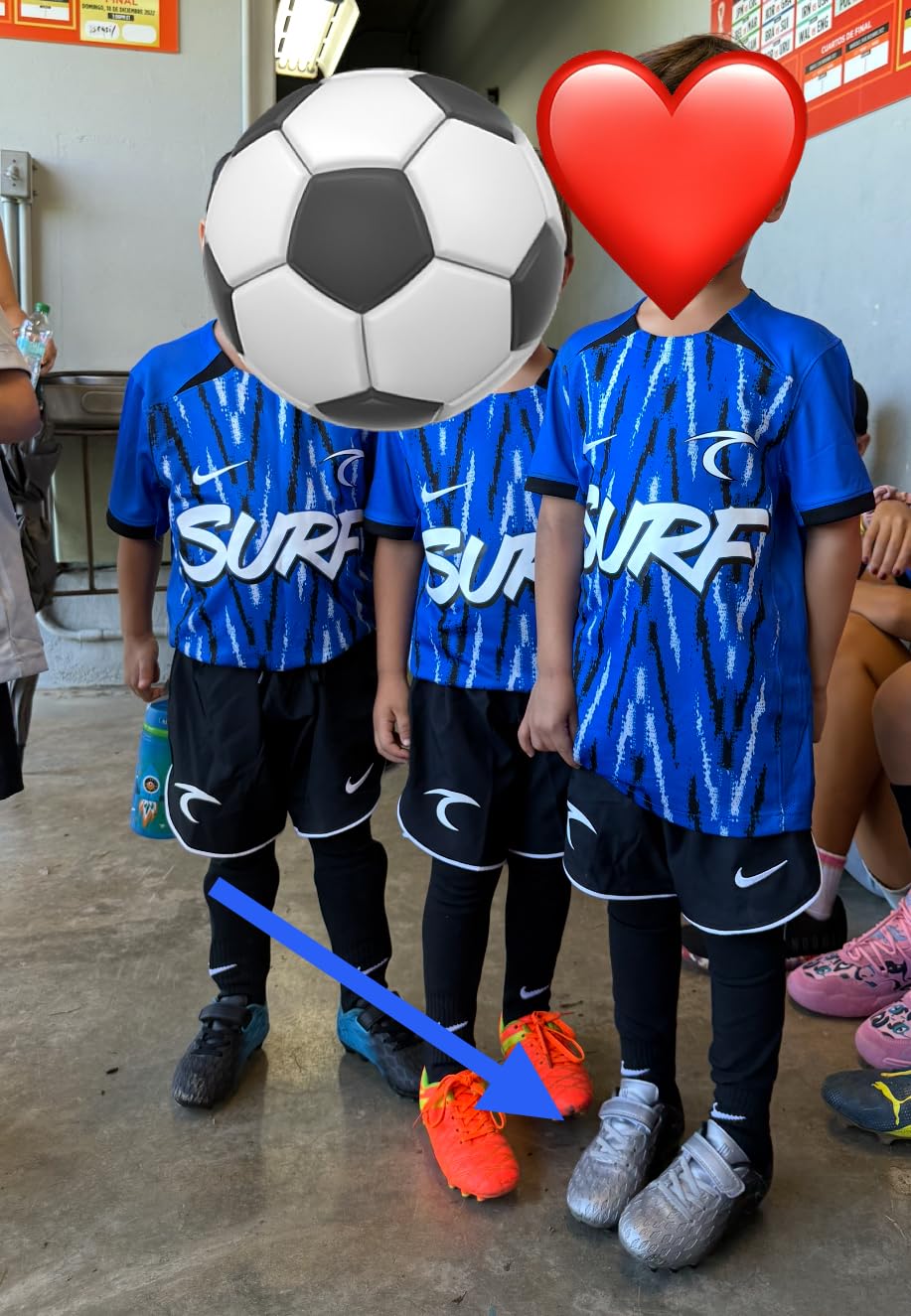 brooman Kids Soccer Cleats black blue colorway showing hook and loop closure design