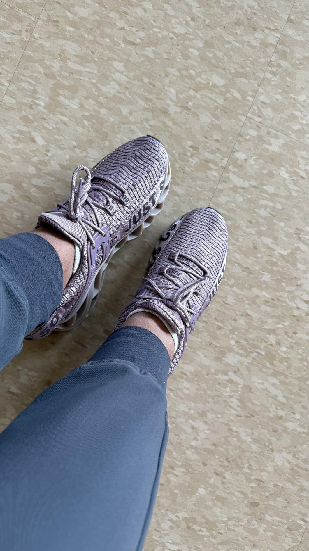 Close-up of Wonesion shoe design showing knitted upper and colorful sole details