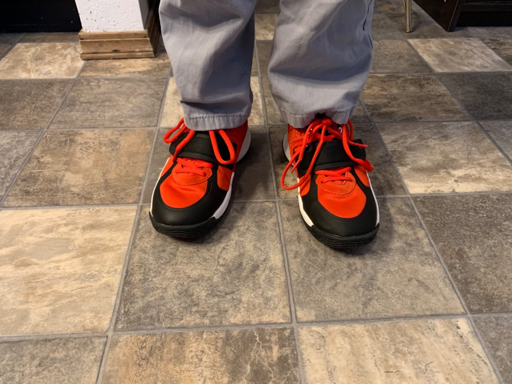 AND1 Boys Girls Basketball Shoes red colorway showing mid-top design and rubber outsole pattern