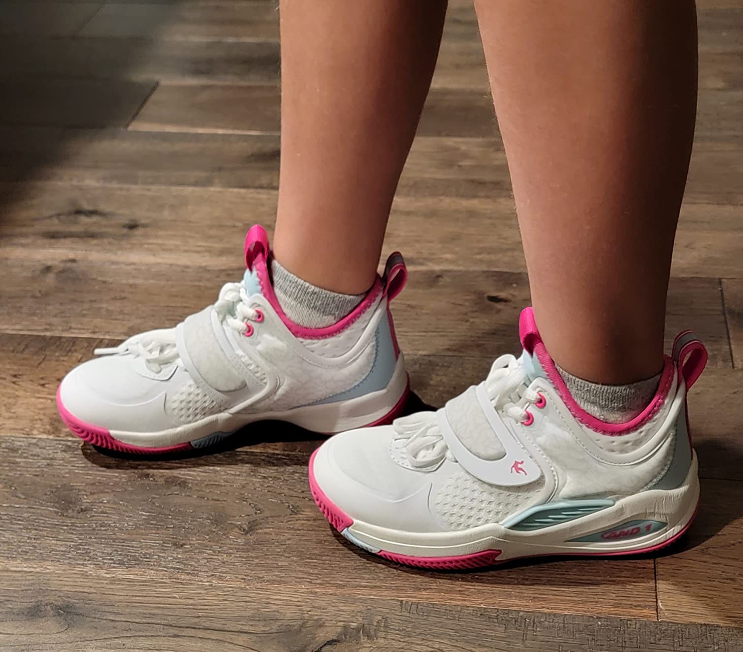 AND1 basketball shoes on court showing traction pattern and performance during game action