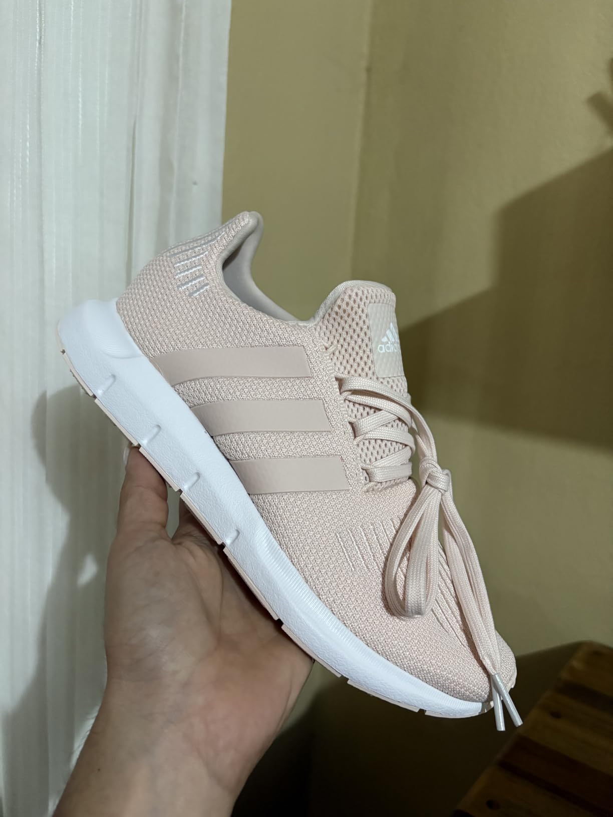 Adidas Women's Swift Run Sneaker in white colorway showing knit upper design and EVA midsole