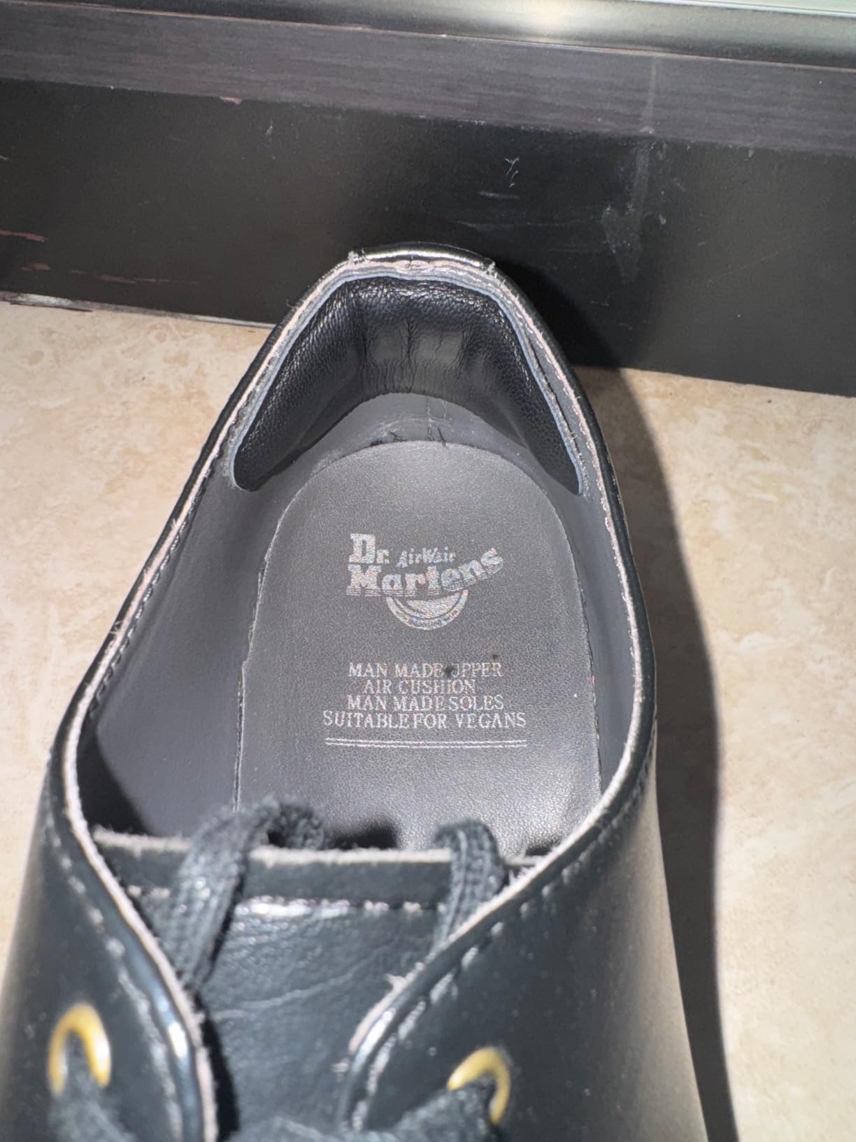 Close-up showing suede texture and cushioning thickness of heel pads