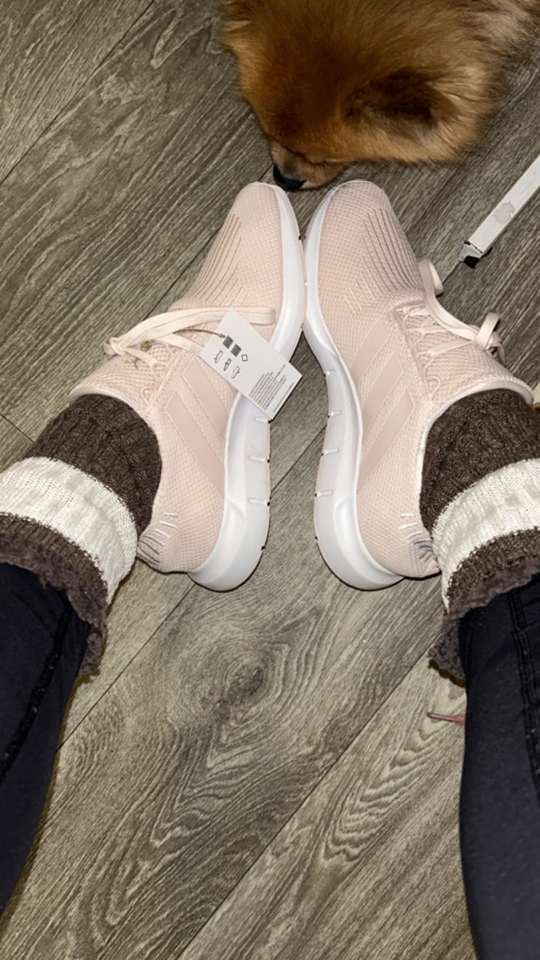 Adidas Swift Run lifestyle sneaker on feet showing how the white colorway pairs with casual outfits