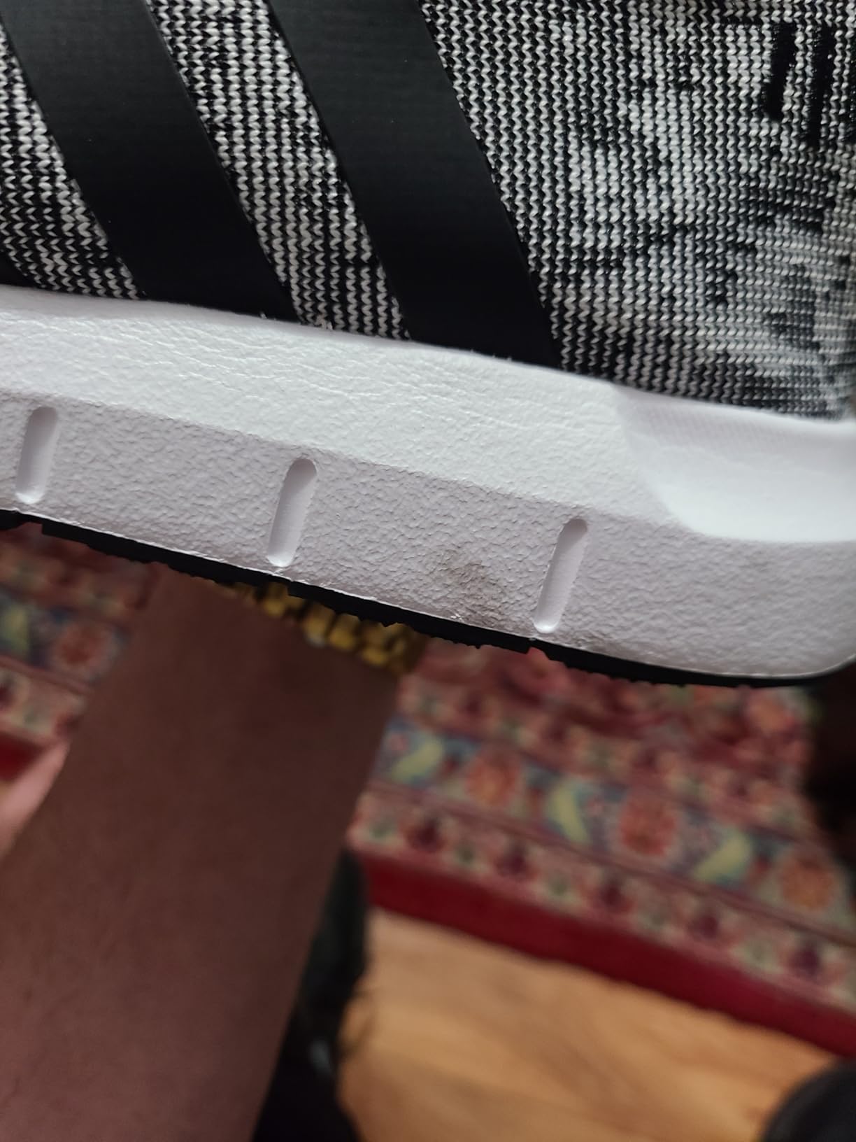 Adidas Swift Run lifestyle shot showing versatile casual sneaker perfect for daily activities