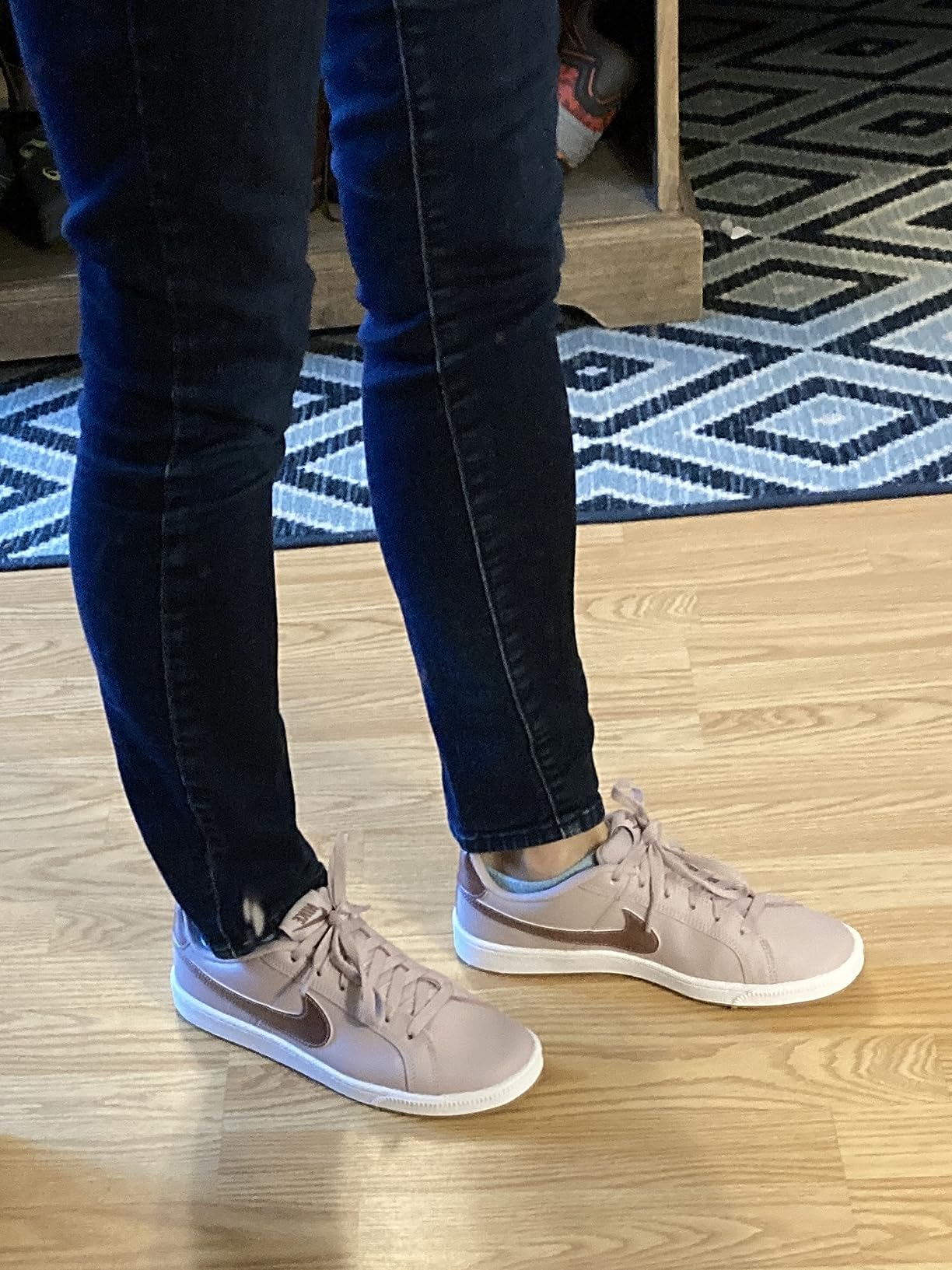 Side profile view of Nike Court Borough Low highlighting the rubber cupsole and classic basketball shoe silhouette