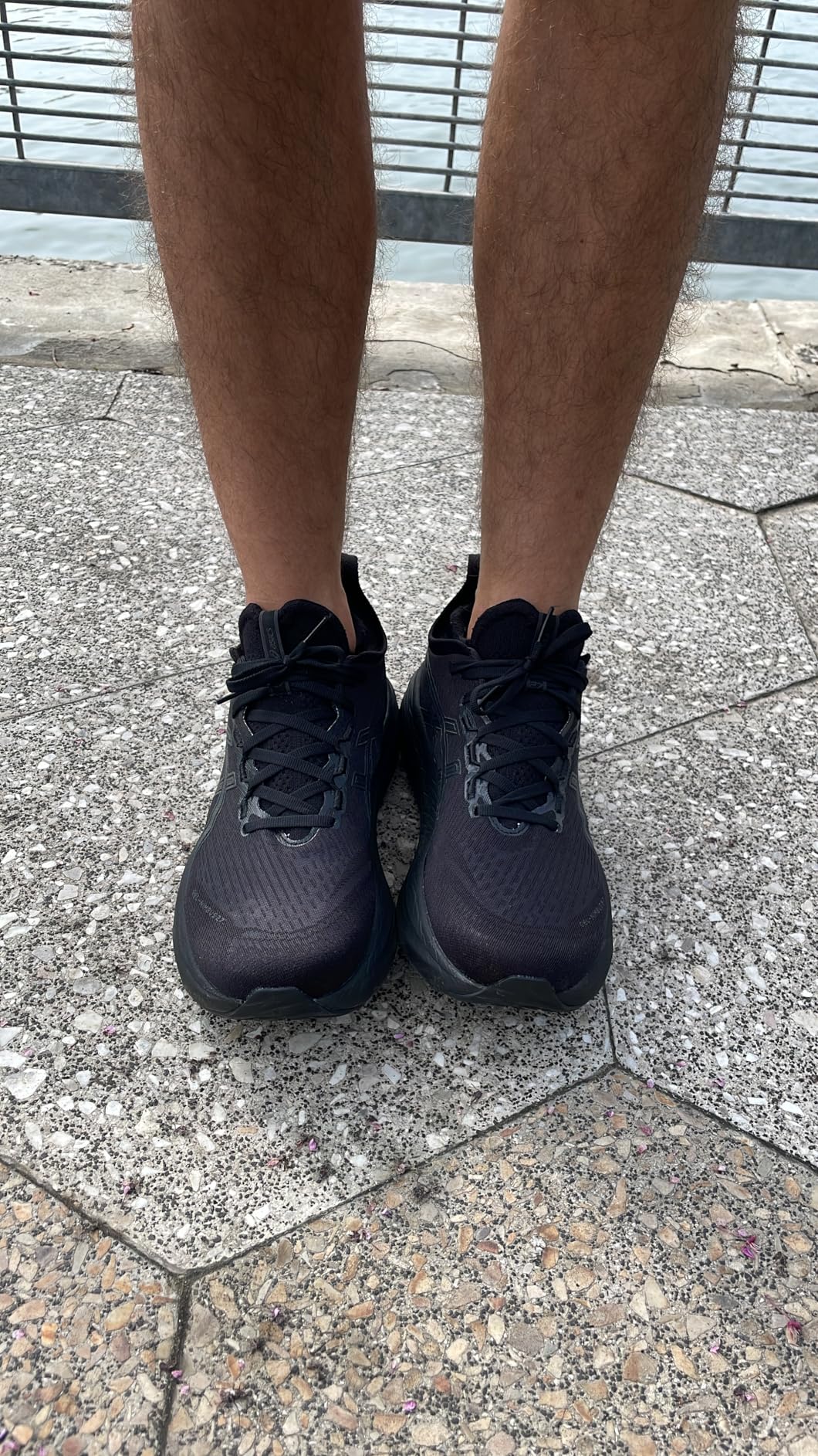 Asics Gel-Nimbus 27 in action during road running showing heel strike and cushioning performance