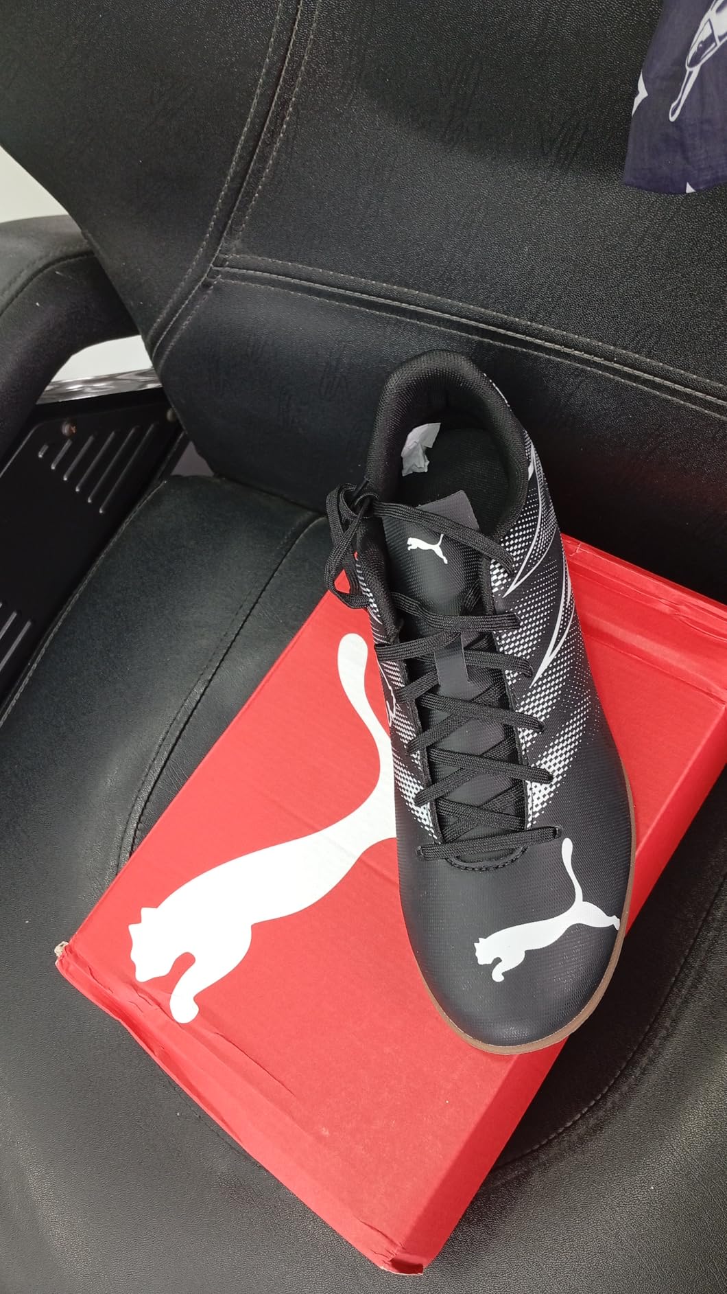 PUMA Men's Attacanto indoor soccer shoe black silver colorway showing synthetic upper and rubber sole