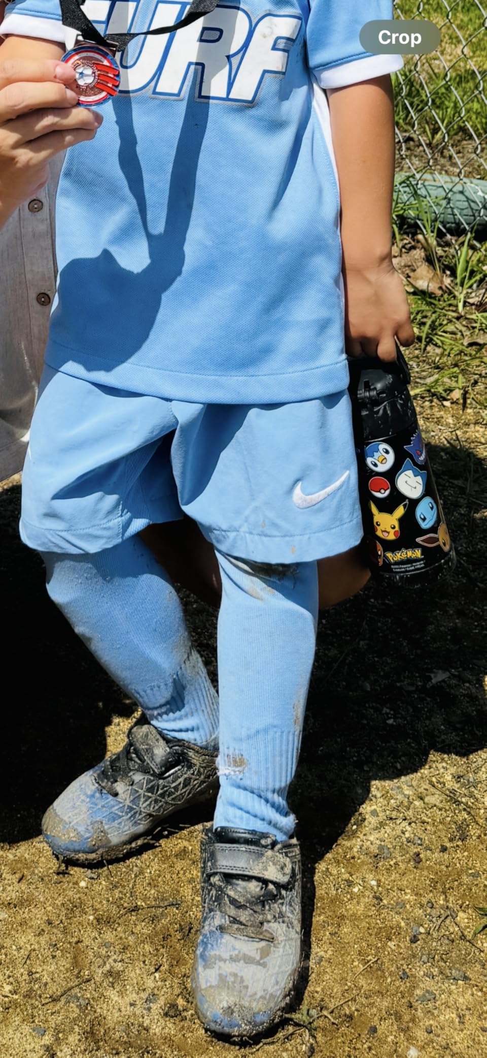 brooman soccer cleats showing textured upper material and molded rubber cleat pattern