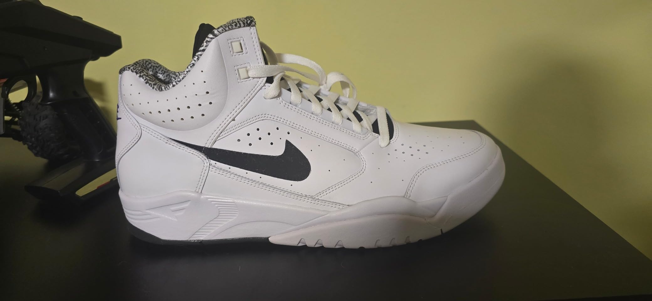 Side profile of the Nike Air Flight Mid in a white, black, lemon, and purple colorway.