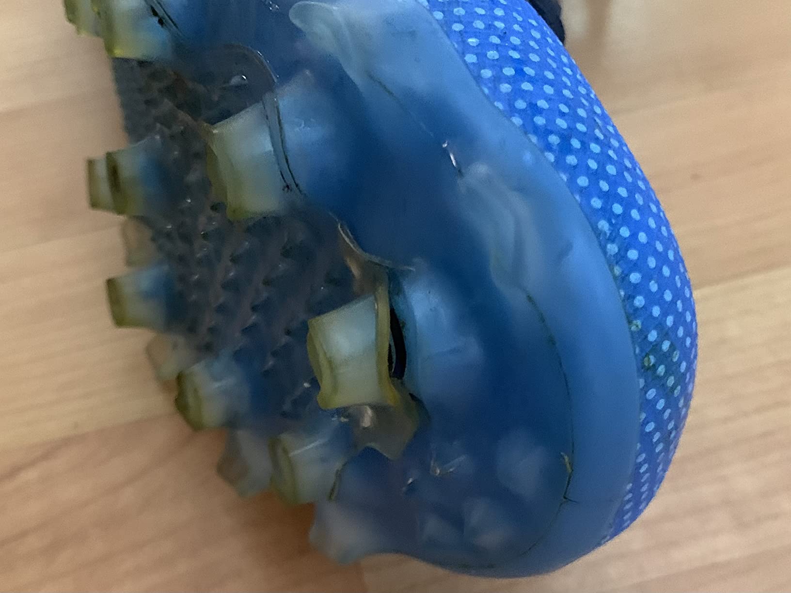 New Balance FreezeLX V4 lacrosse cleats showing QUIX outsole technology and mesh upper design