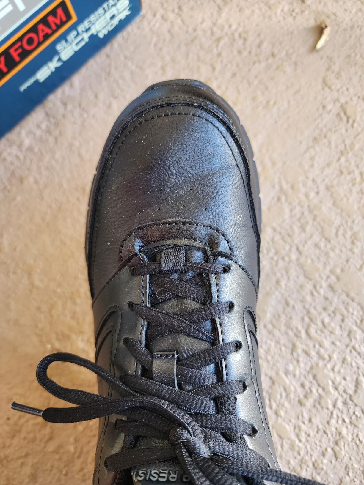 Skechers Nampa side view showing synthetic leather upper and slip-resistant sole pattern