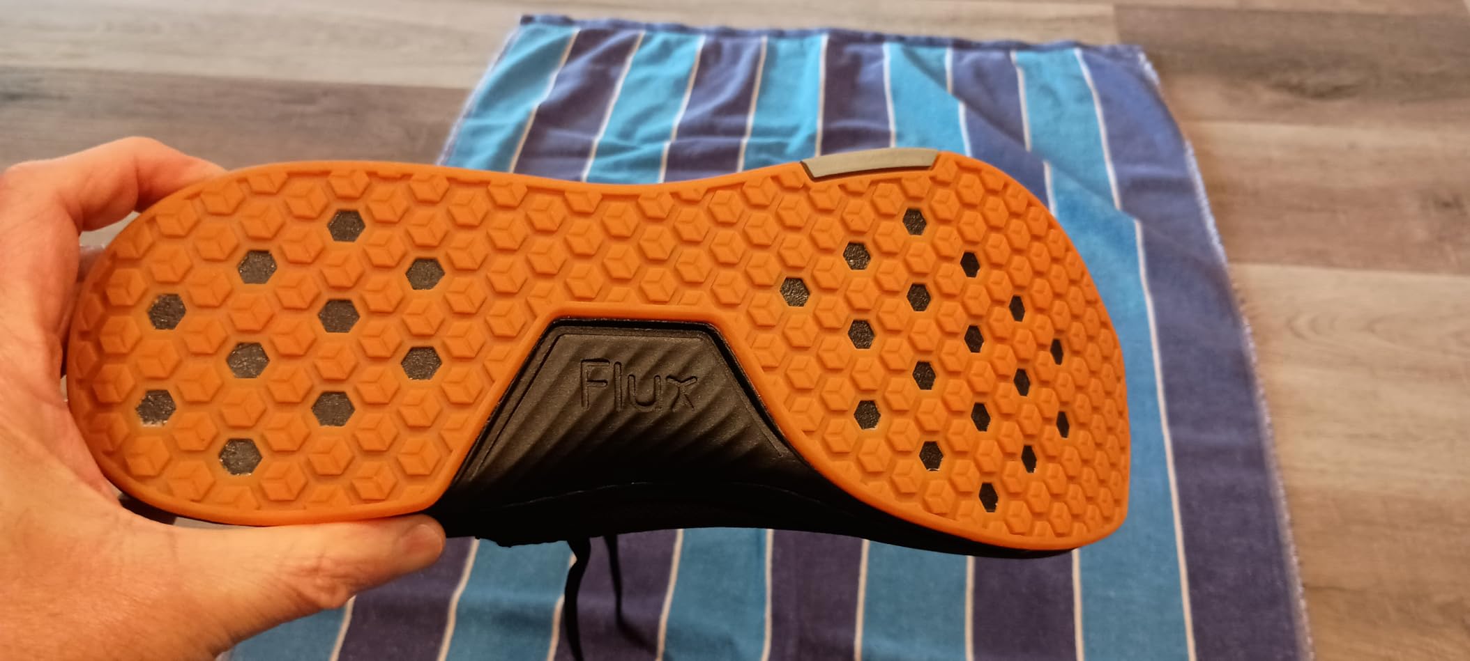 Close-up of FLUX Adapt Runners showing breathable mesh upper and hexagonal outsole pattern