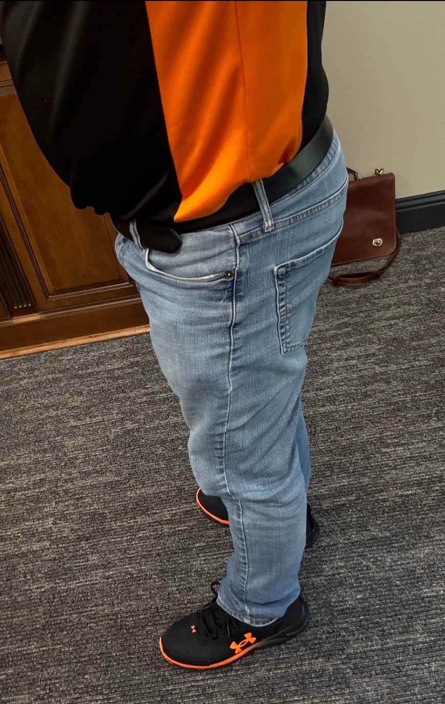 Under Armour Men's Charged Assert 9 black running shoe showing mesh upper and rubber outsole