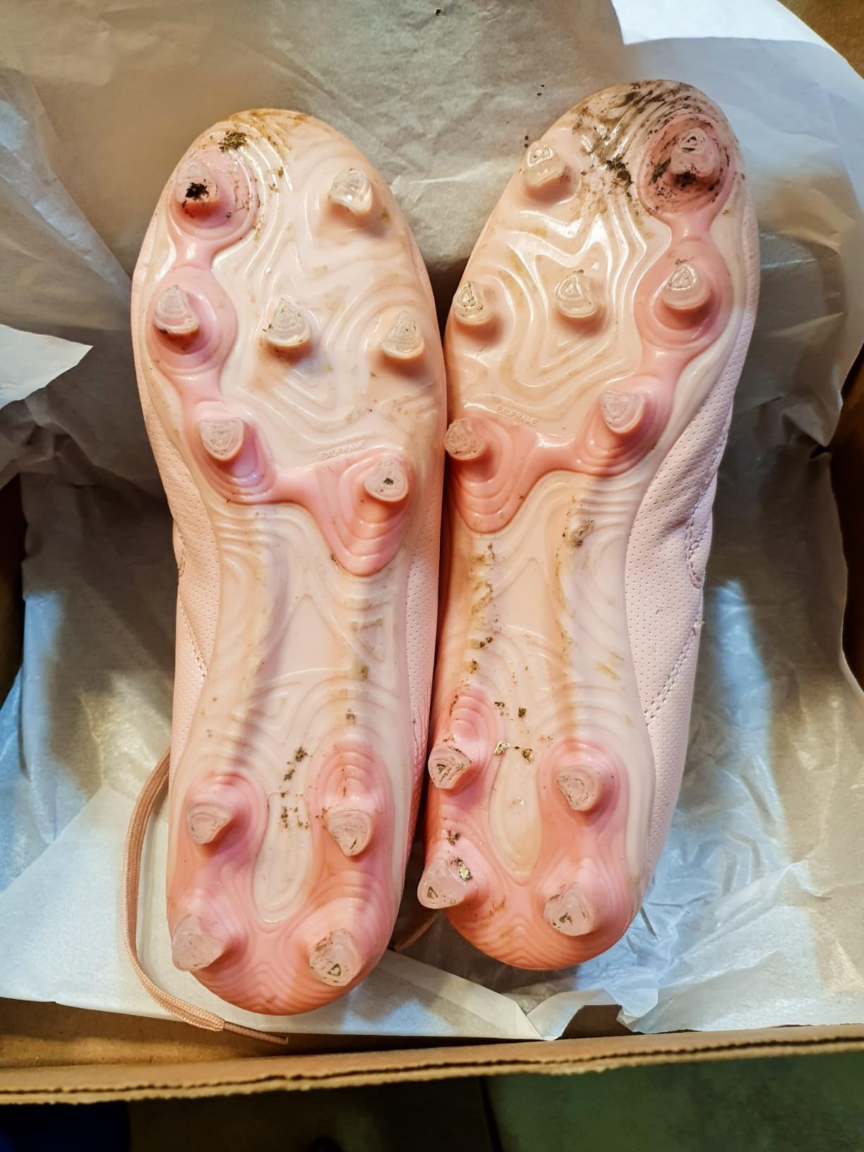 brooman kids soccer cleats showing wear patterns and sole grip design after field testing