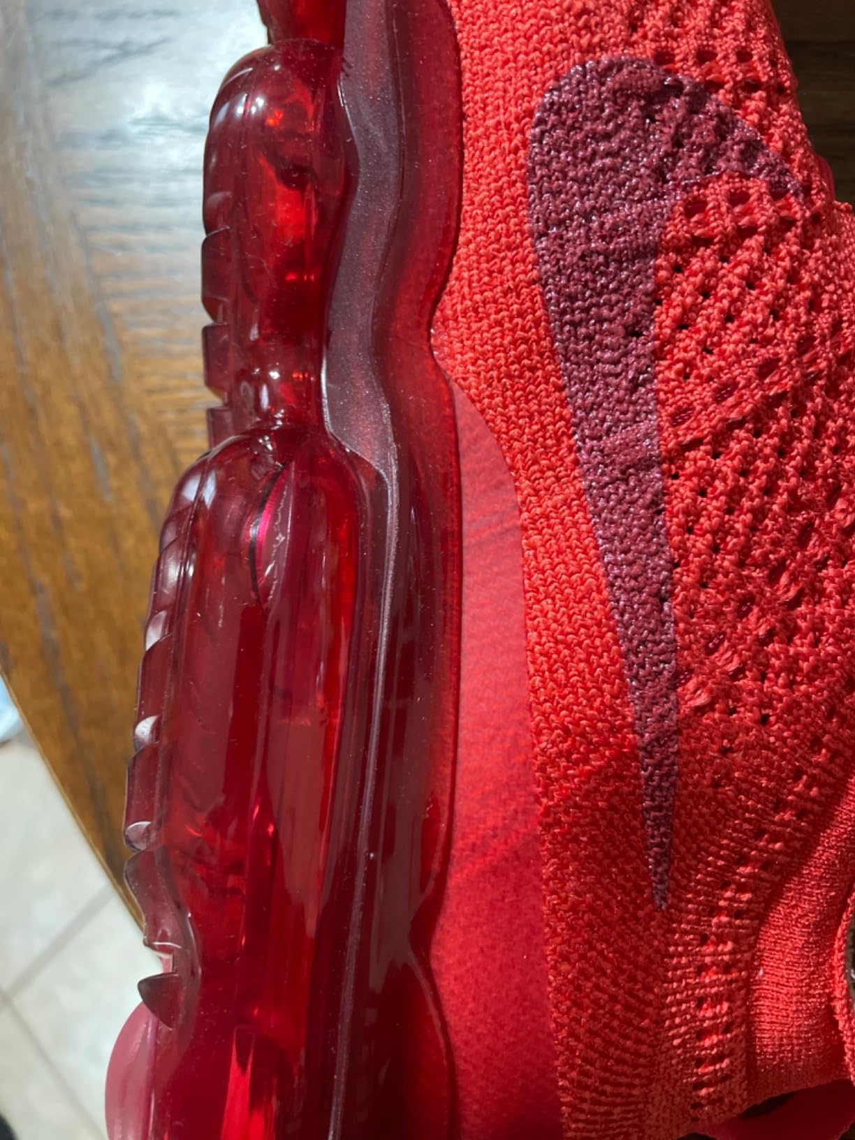 Close-up view of Nike Women's Basketball Gymnastics Shoes showing synthetic upper construction and lacing system