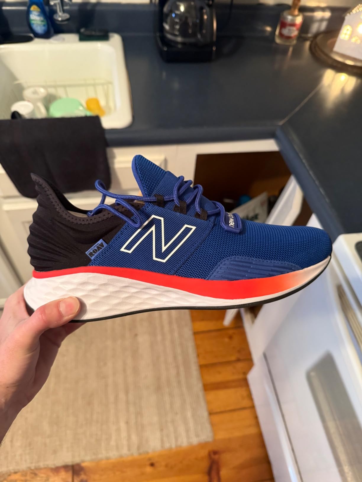 Close-up of New Balance Roav V1 showing Ultra Heel design and mesh construction details