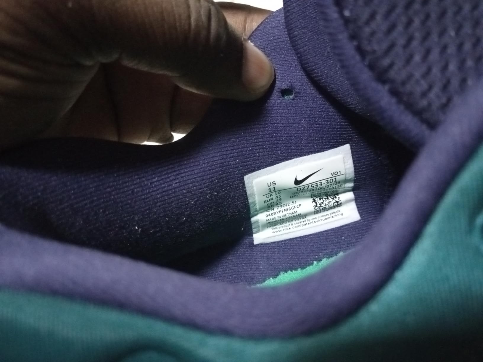 Nike basketball shoe detail showing three quarters tall ankle design and sole pattern