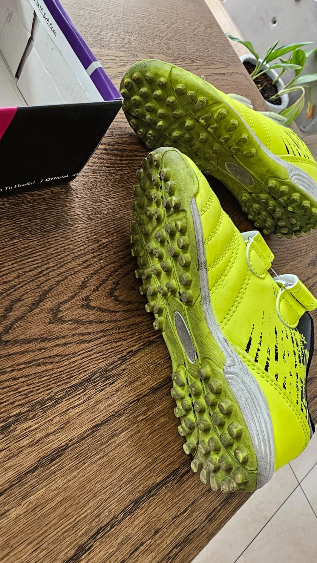 brooman kids soccer shoes showing synthetic upper construction and velcro strap detail