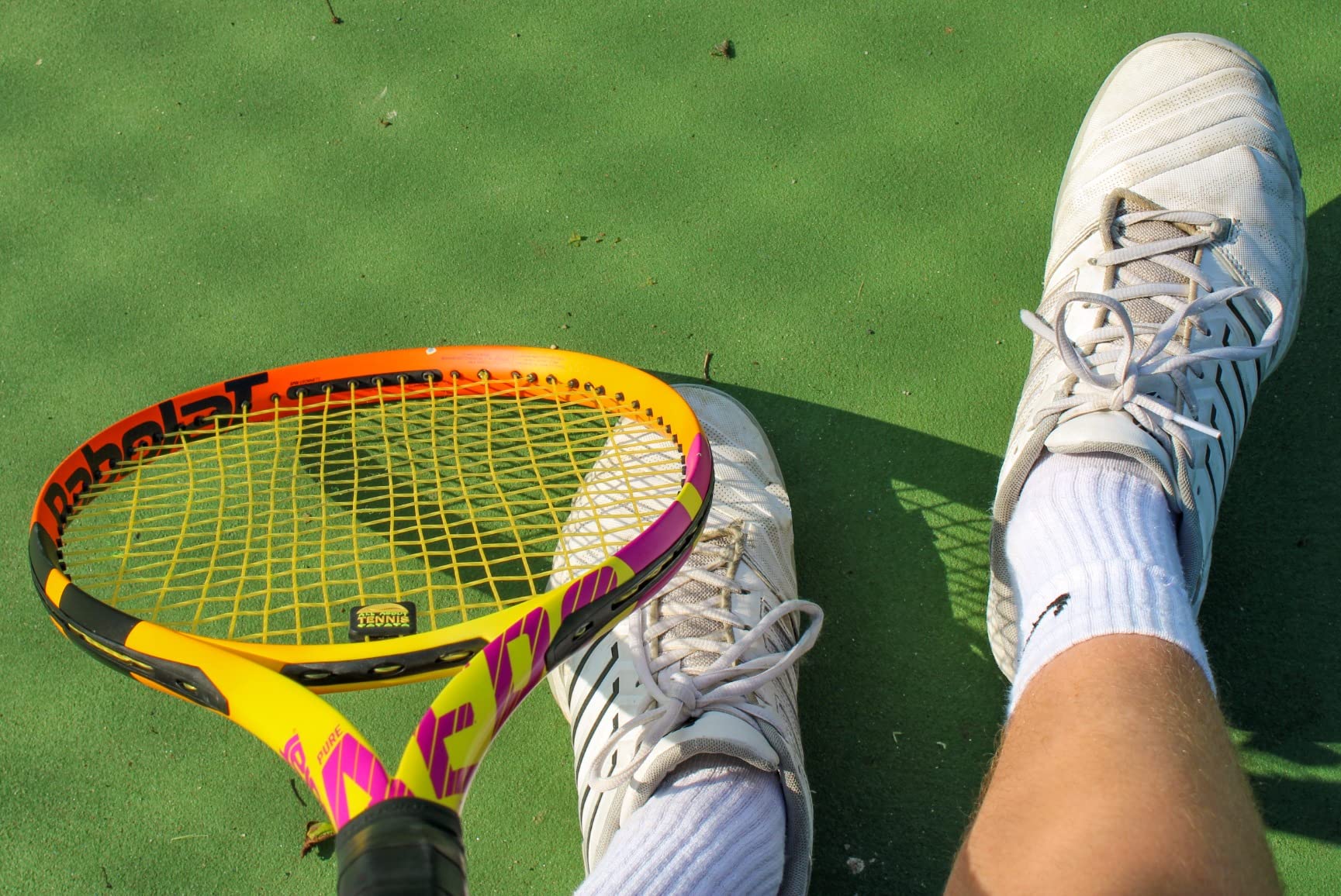 K-Swiss tennis shoes on court showing traction pattern and wear resistance during play