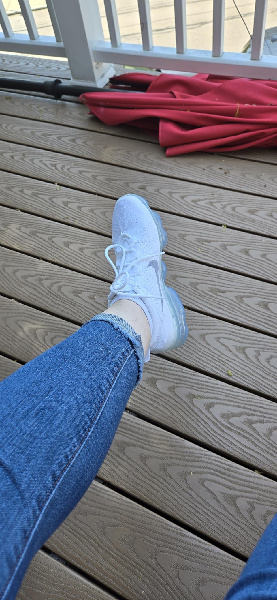 Nike Women's Basketball Gymnastics Shoes showing white and gray colorway with Air cushioning technology