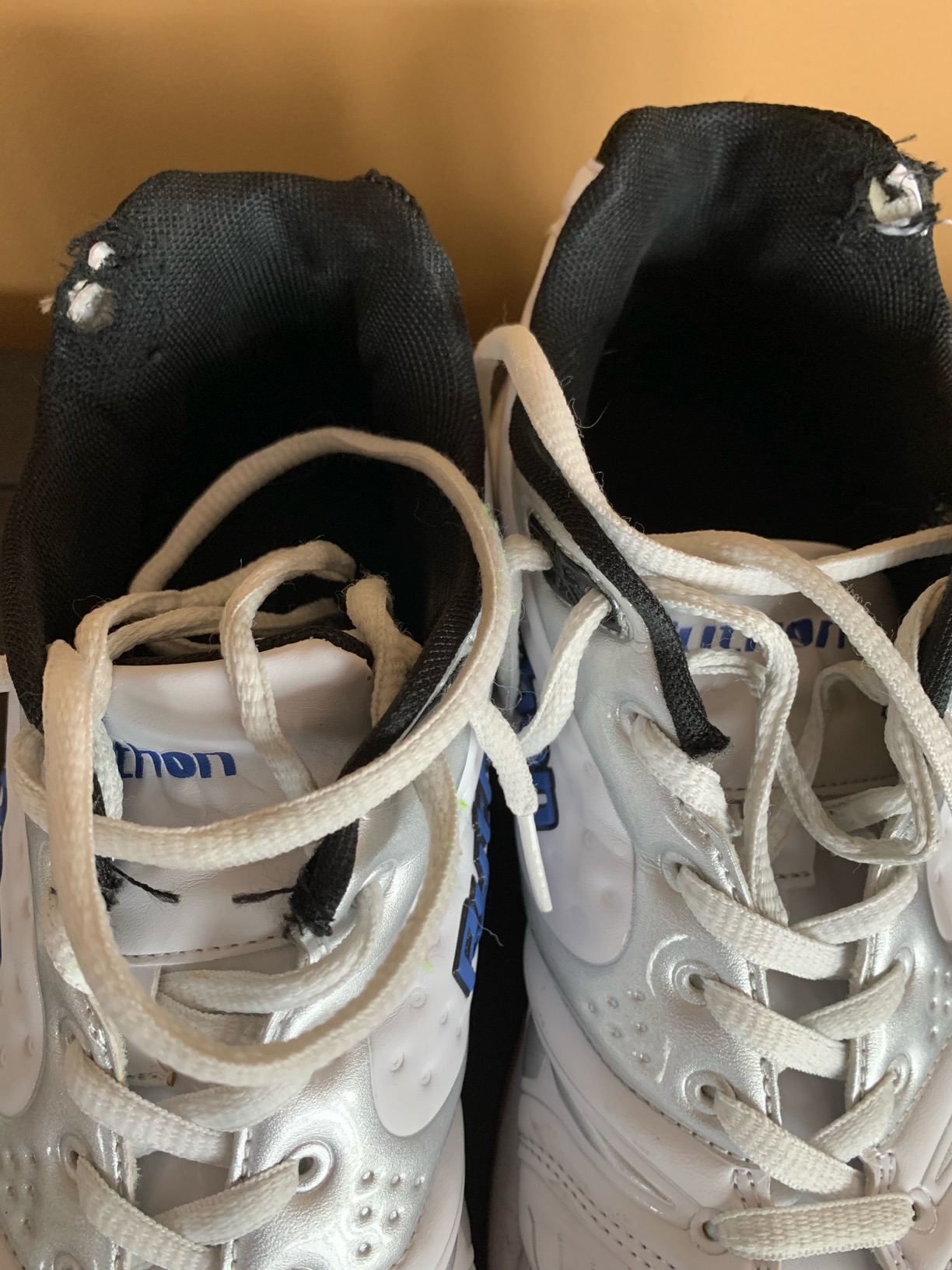 Python court shoes showing wear patterns and construction details after use