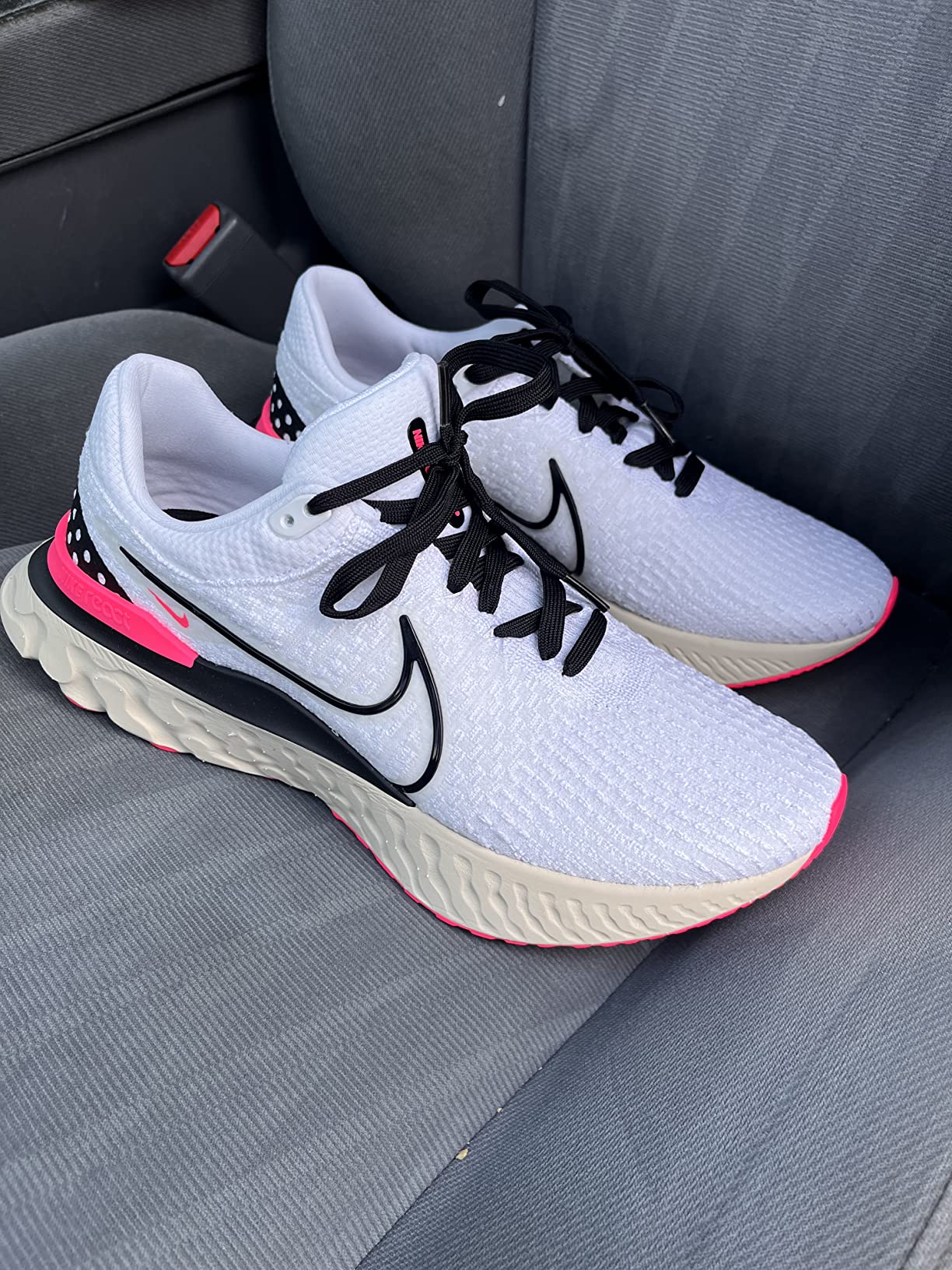 Nike Downshifter 12 side profile showing midsole cushioning and outsole pattern