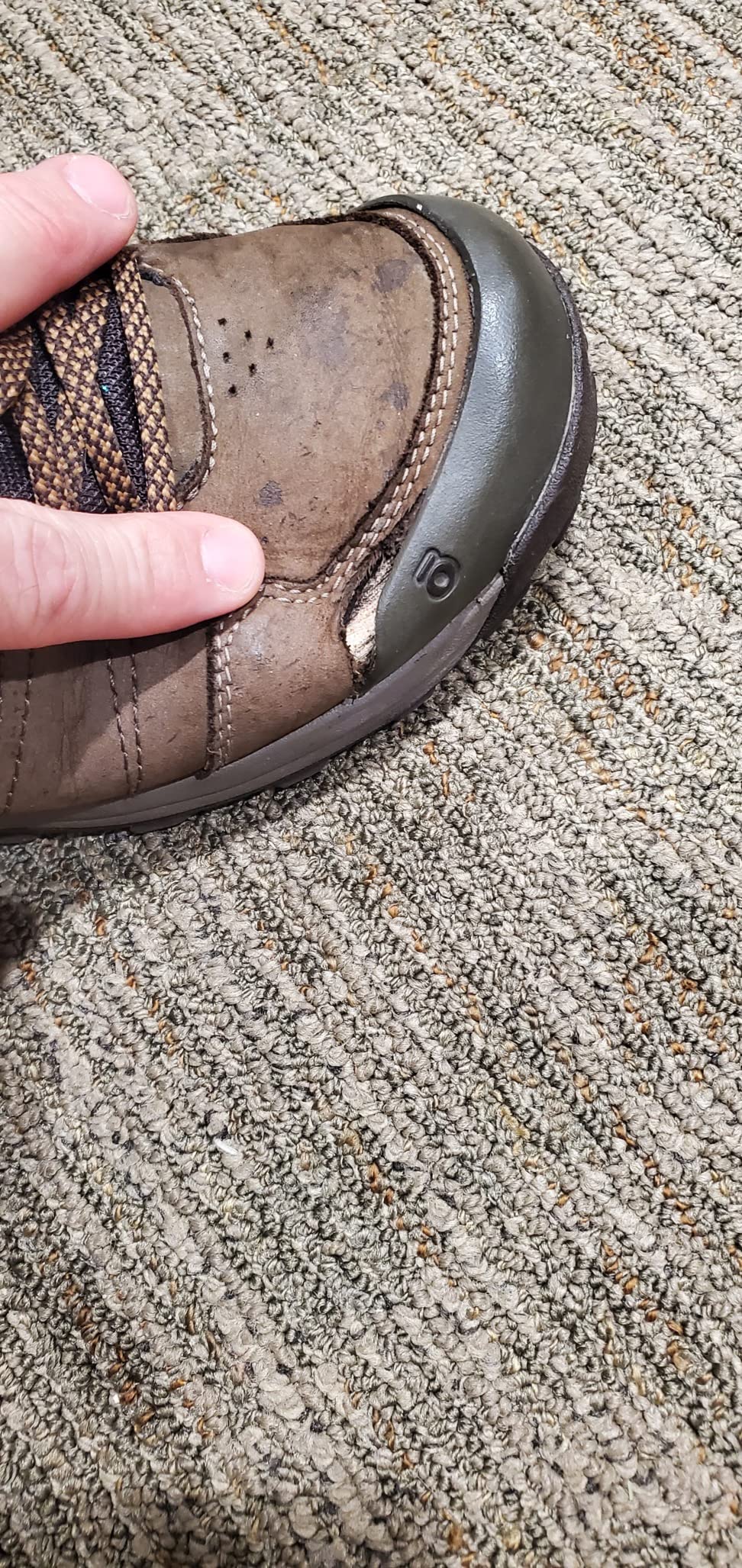 Oboz Sypes showing wear damage and hole development near toe area after 6 months use