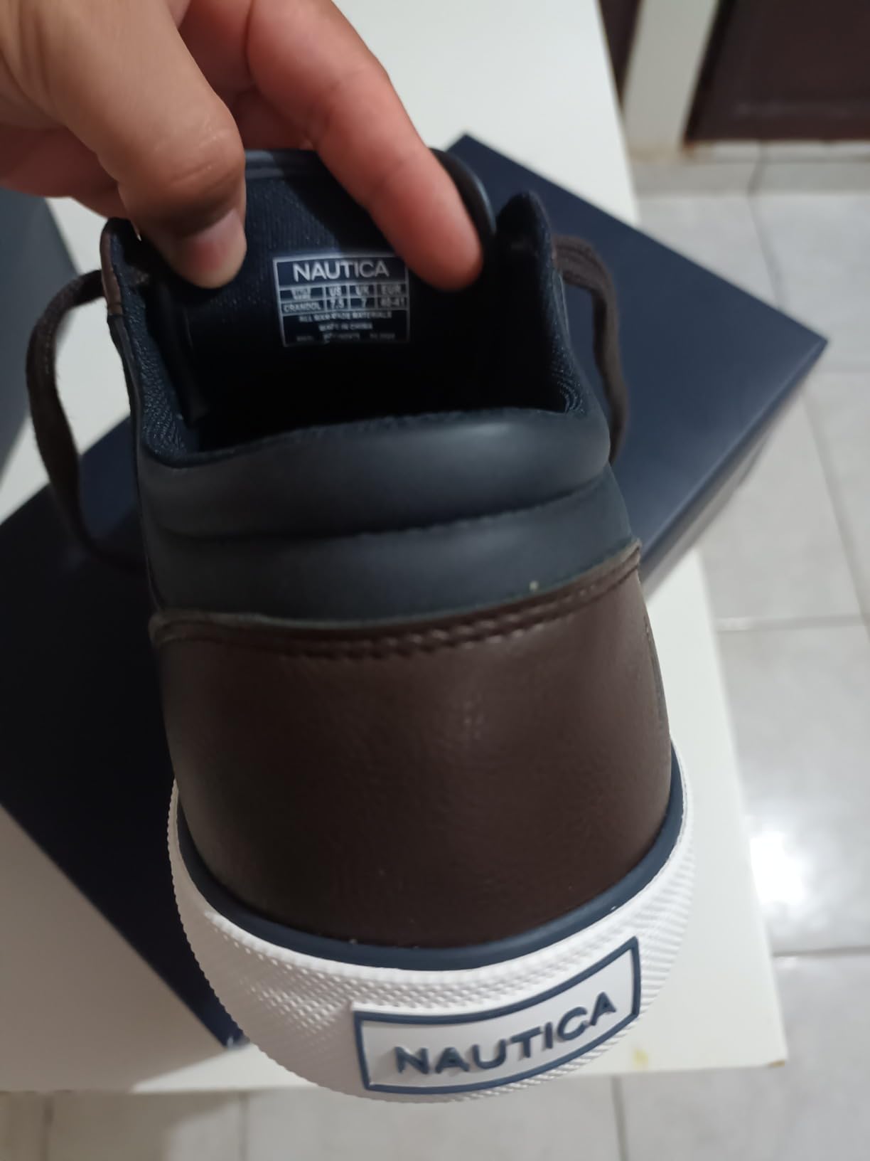 Nautica boat shoes worn with business casual outfit showing versatile styling for office to weekend wear