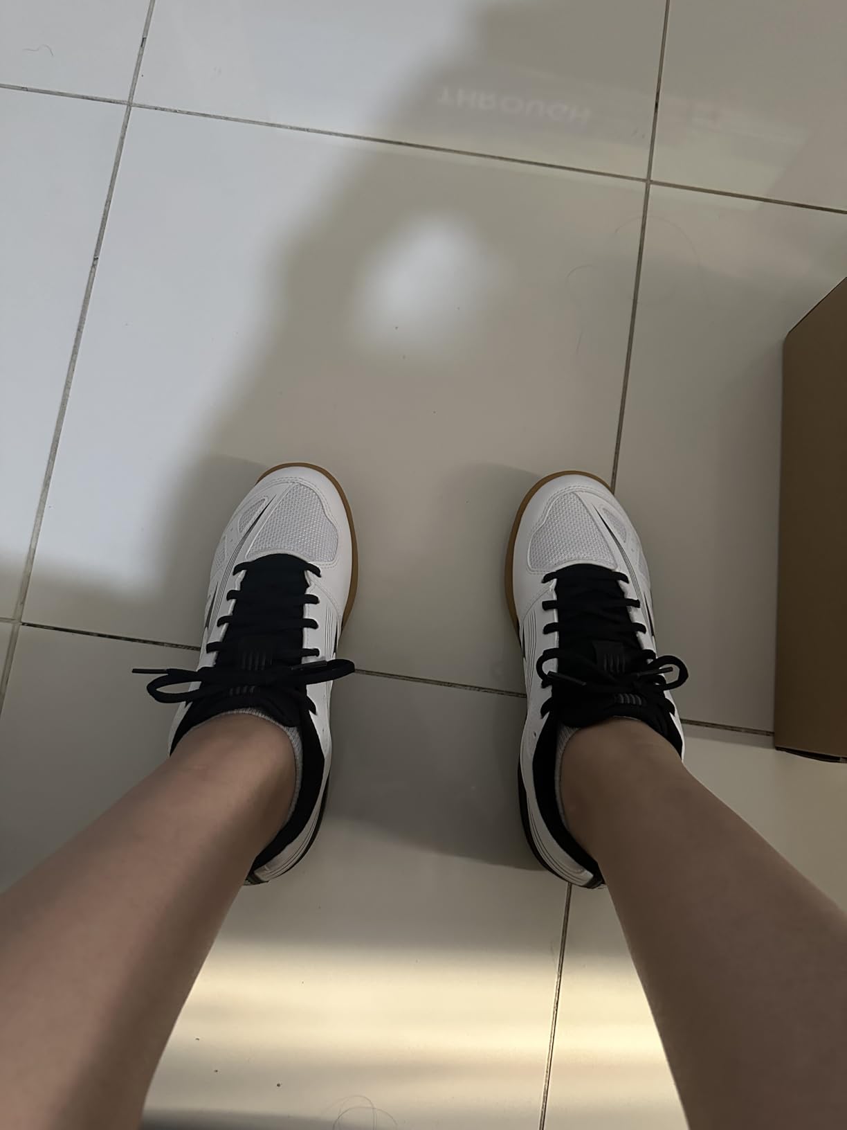 Mizuno Women's Cyclone Speed 3 volleyball shoes in white and black colorway, side profile view showing lightweight design and synthetic overlays