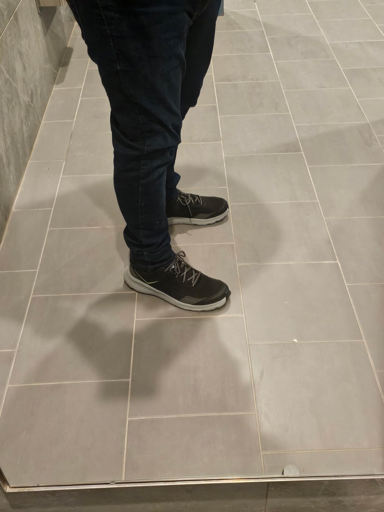 Columbia Men's Vertisol Trail Hiking Shoe black and grey colorway showing mesh upper and aggressive tread pattern