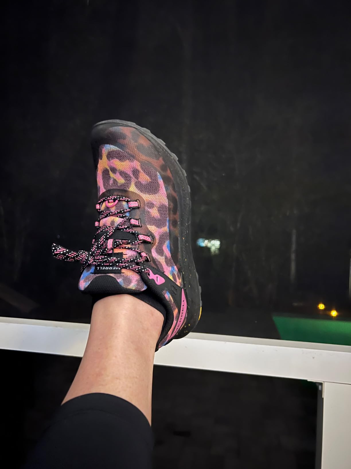 Close-up detail of Merrell Antora 3 mesh upper construction and lacing system