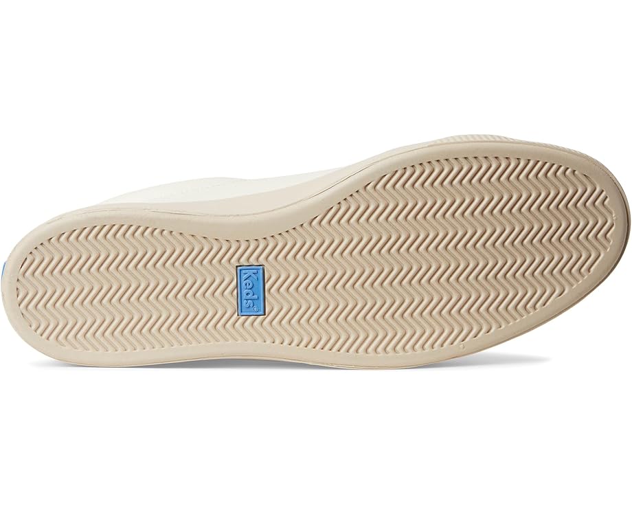 Side view of Keds Pursuit sneaker showing low-profile silhouette and minimal design