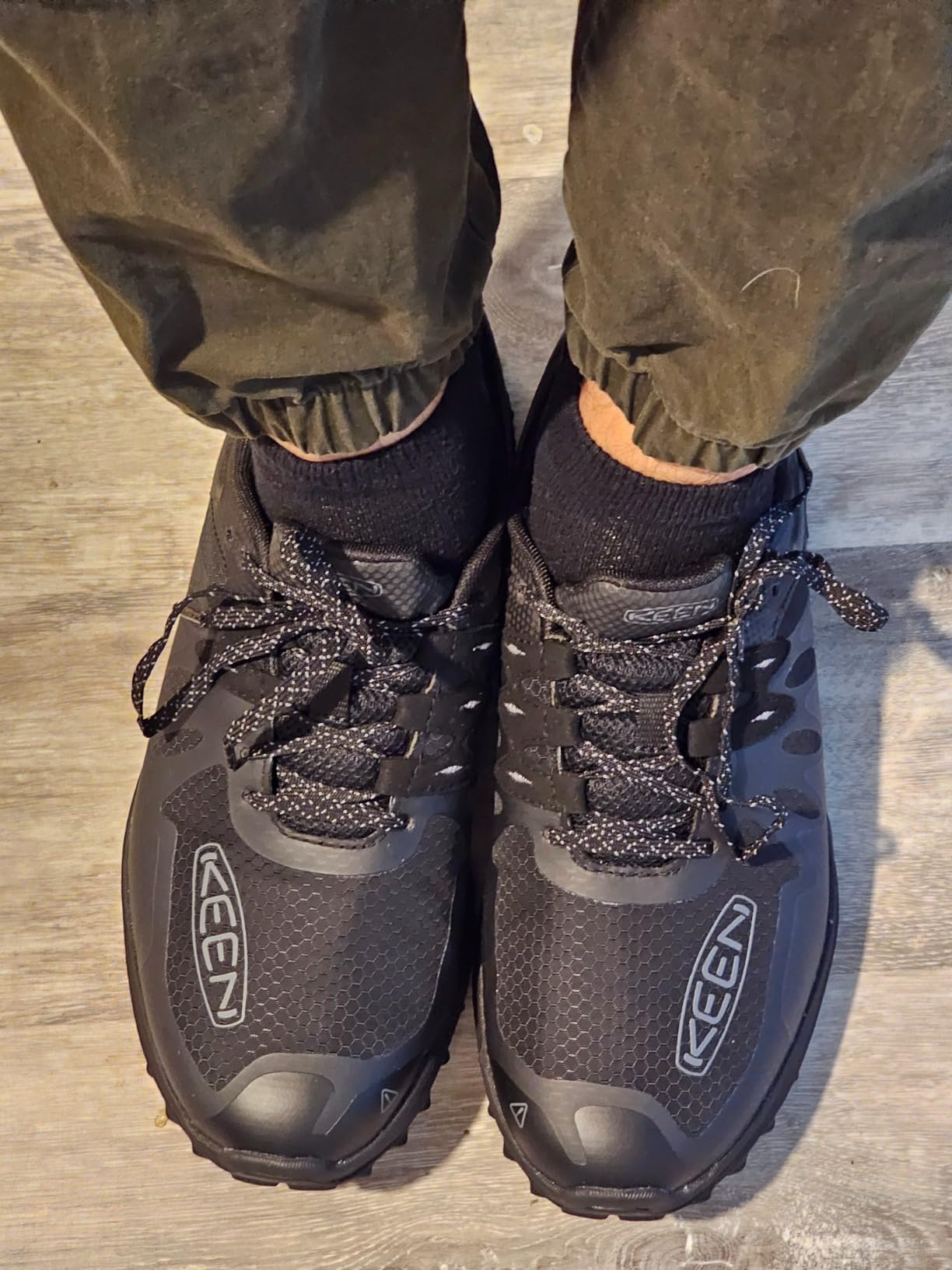 KEEN Men's Zionic Low Height Hiking Shoes Dark Olive Scarlet Ibis colorway displayed on white background