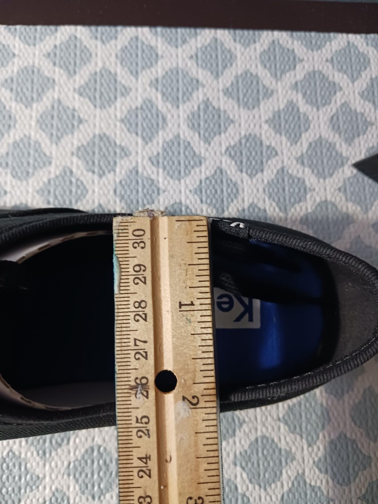 Woman wearing Keds Champion sneakers while running errands