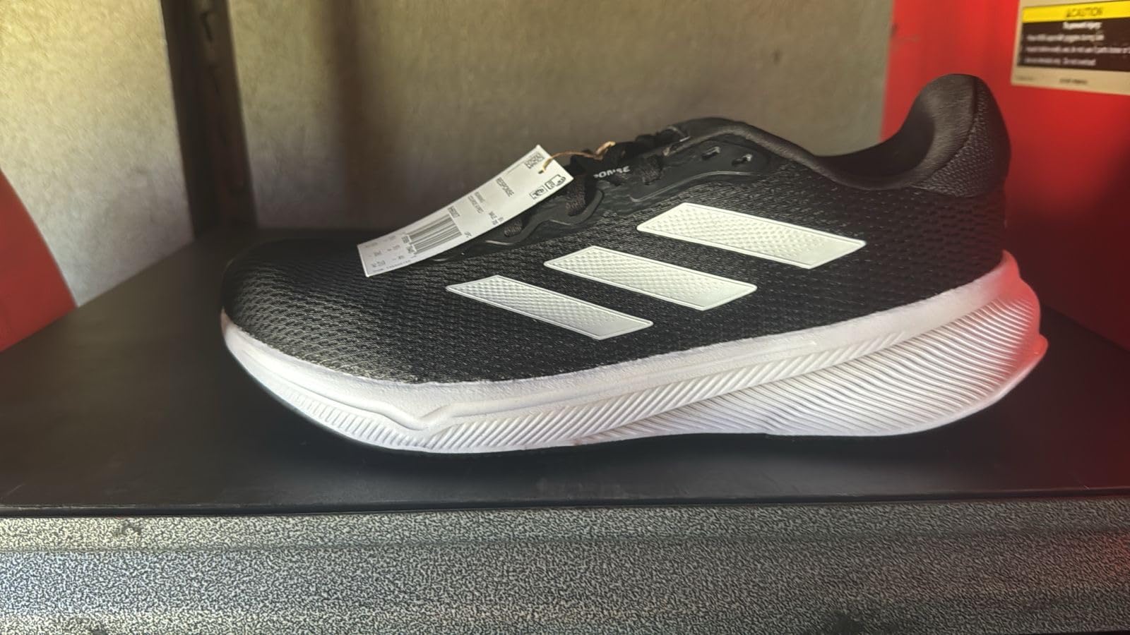 Adidas Response running shoe bottom view showing rubber outsole tread pattern