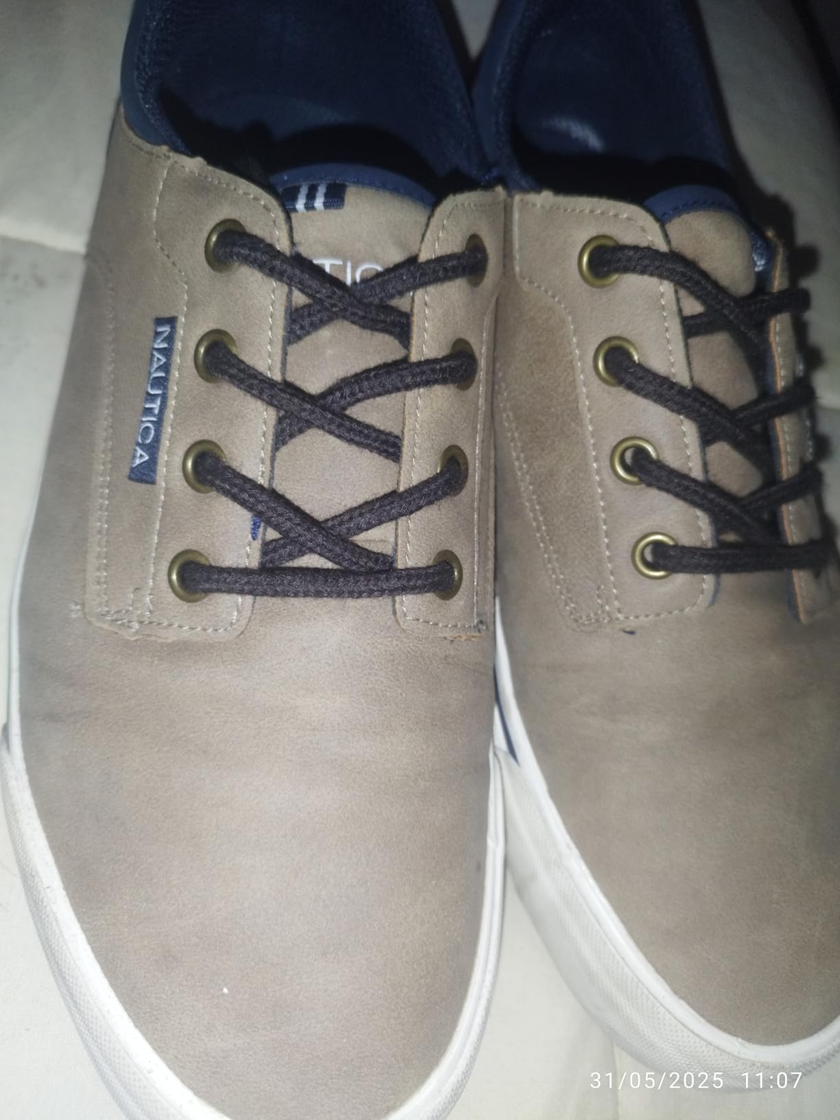 Nautica Men's Classic Lace-Up Boat Shoes in tan colorway showing low-top design with rubber sole and classic boat shoe silhouette