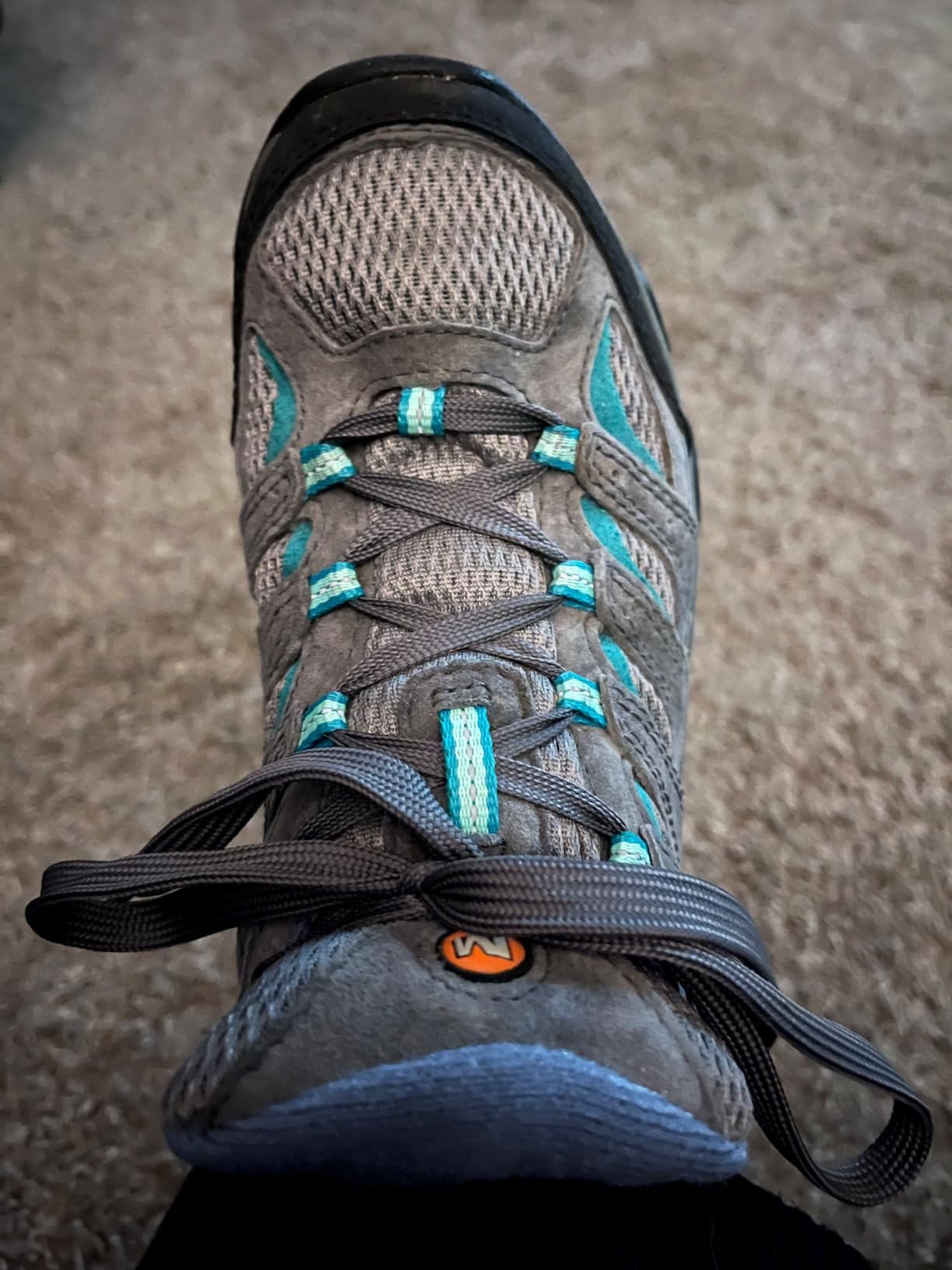 Merrell Moab 3 detail showing protective rubber toe cap and breathable mesh upper panels