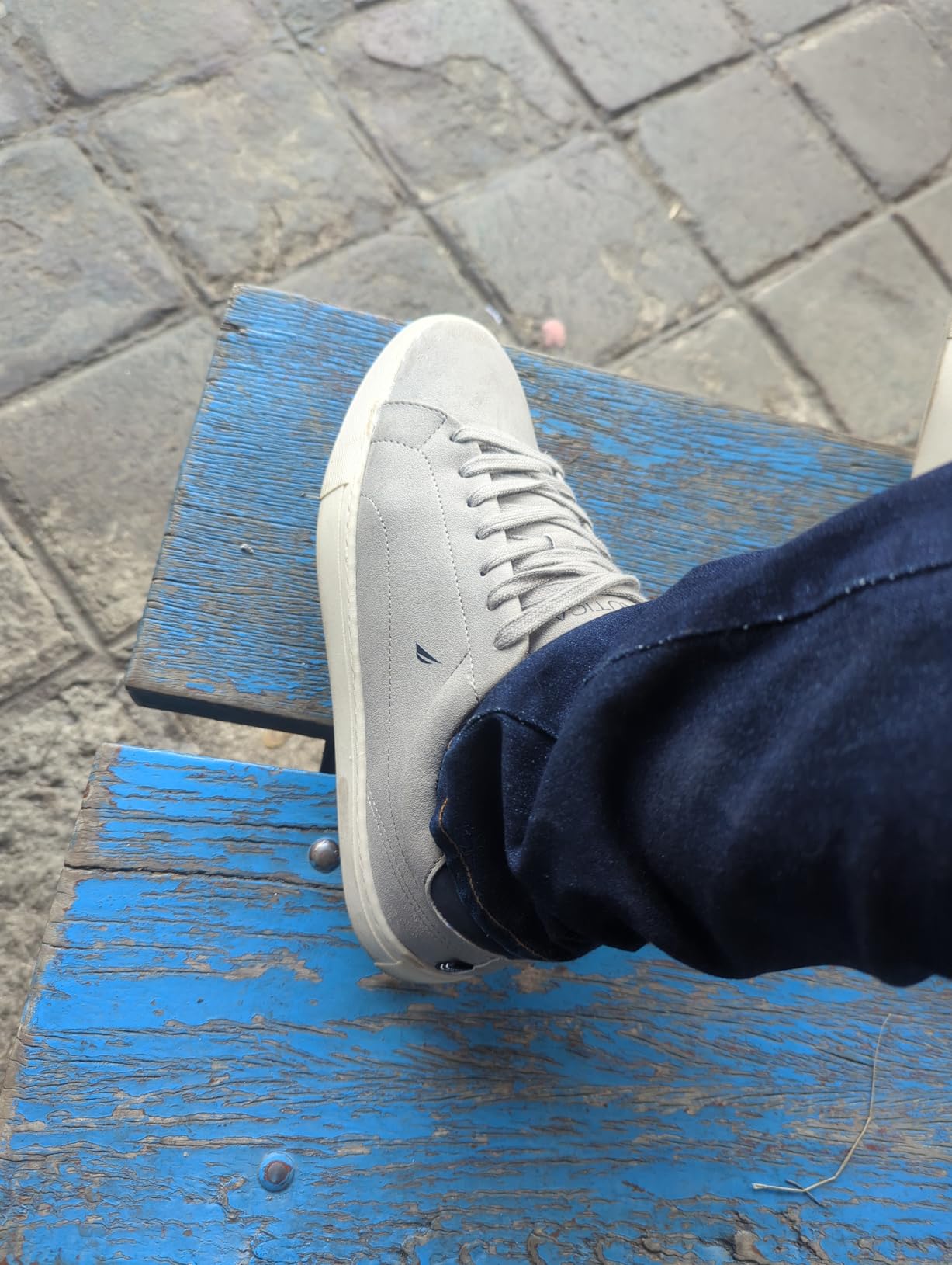 Close-up detail of Nautica boat shoe faux suede upper material and lace-up closure system showing construction quality