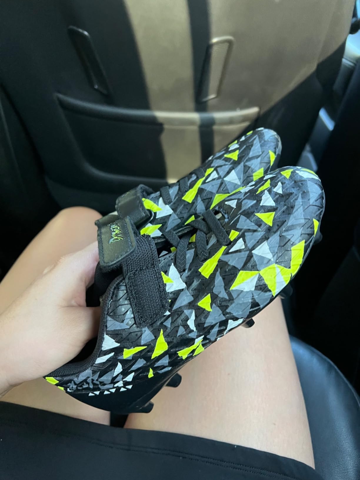 DREAM PAIRS soccer cleats detailed view showing textured upper and stud pattern