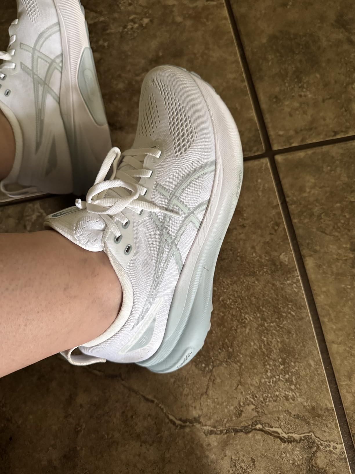 ASICS Gel-Kayano 31 side profile showing 4D Guidance System and PureGEL technology in heel