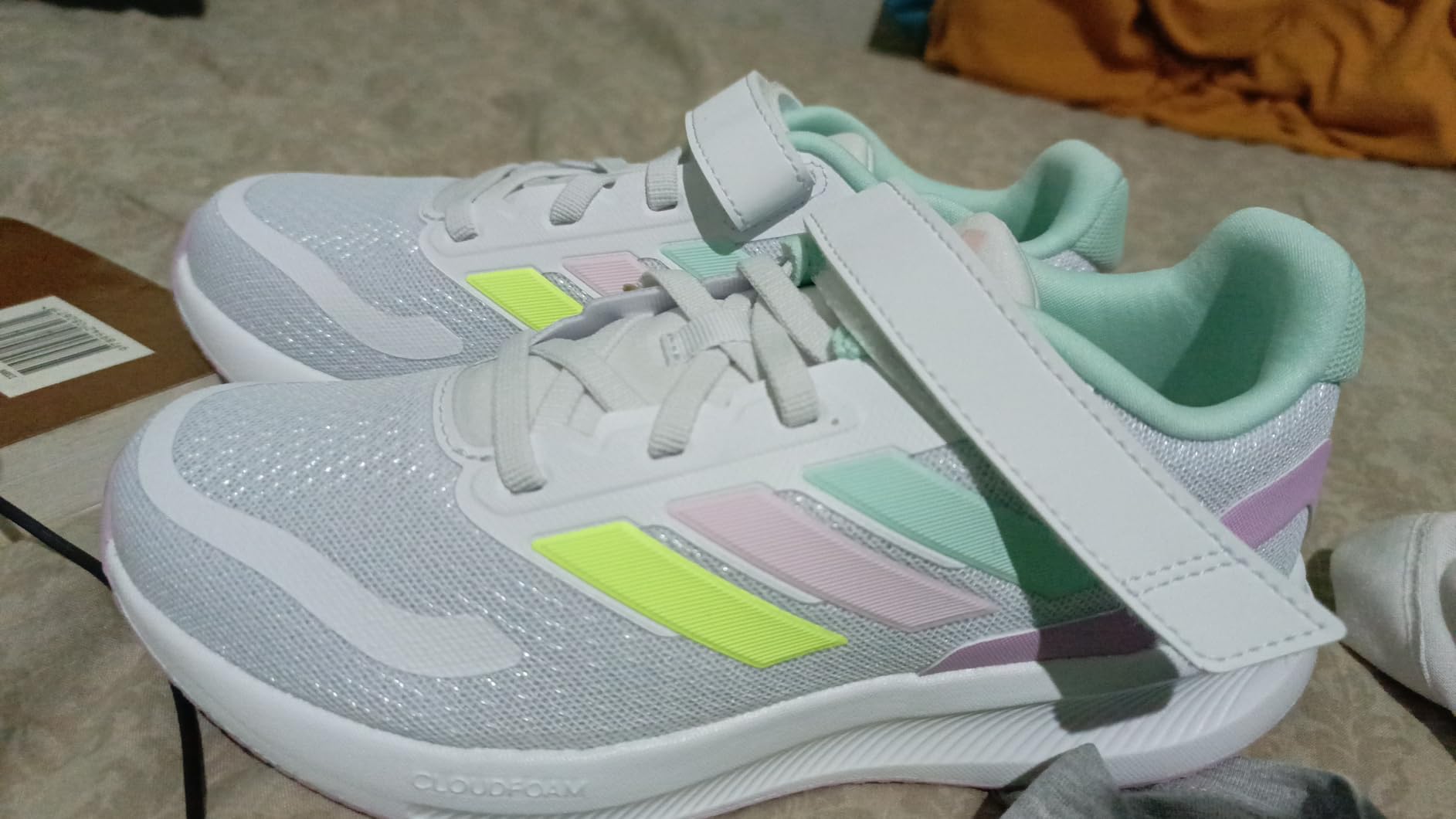 Close-up of Adidas Run Falcon 5 showing Cloudfoam midsole and textile upper construction