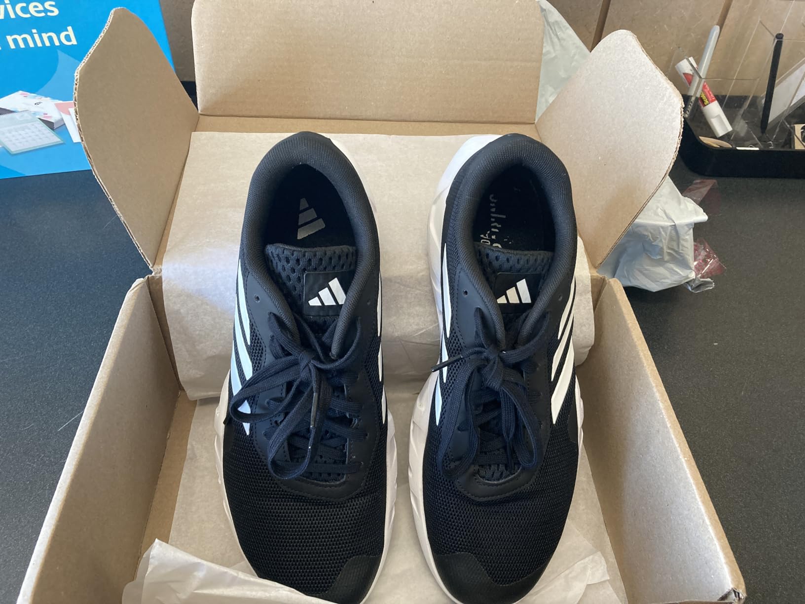 Close-up detail of Adidas Amplimove mesh upper construction and TPU overlays