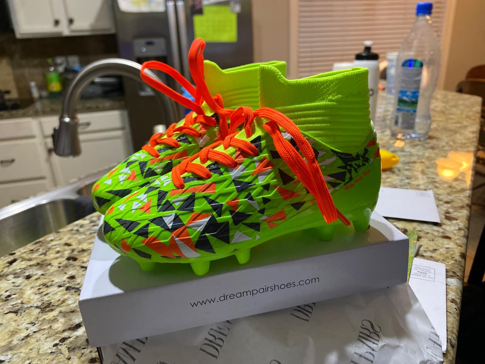 DREAM PAIRS Boys Football Cleats orange blue colorway showing high ankle sock design