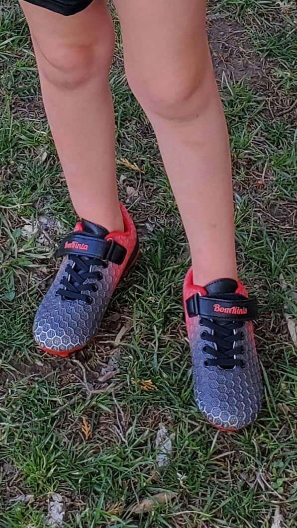Young player wearing BomKinta soccer cleats during practice showing real-world usage