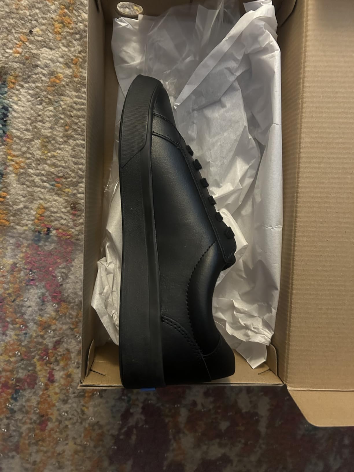 Customer photo showing real-world wear and creasing on Keds Pursuit white leather sneaker