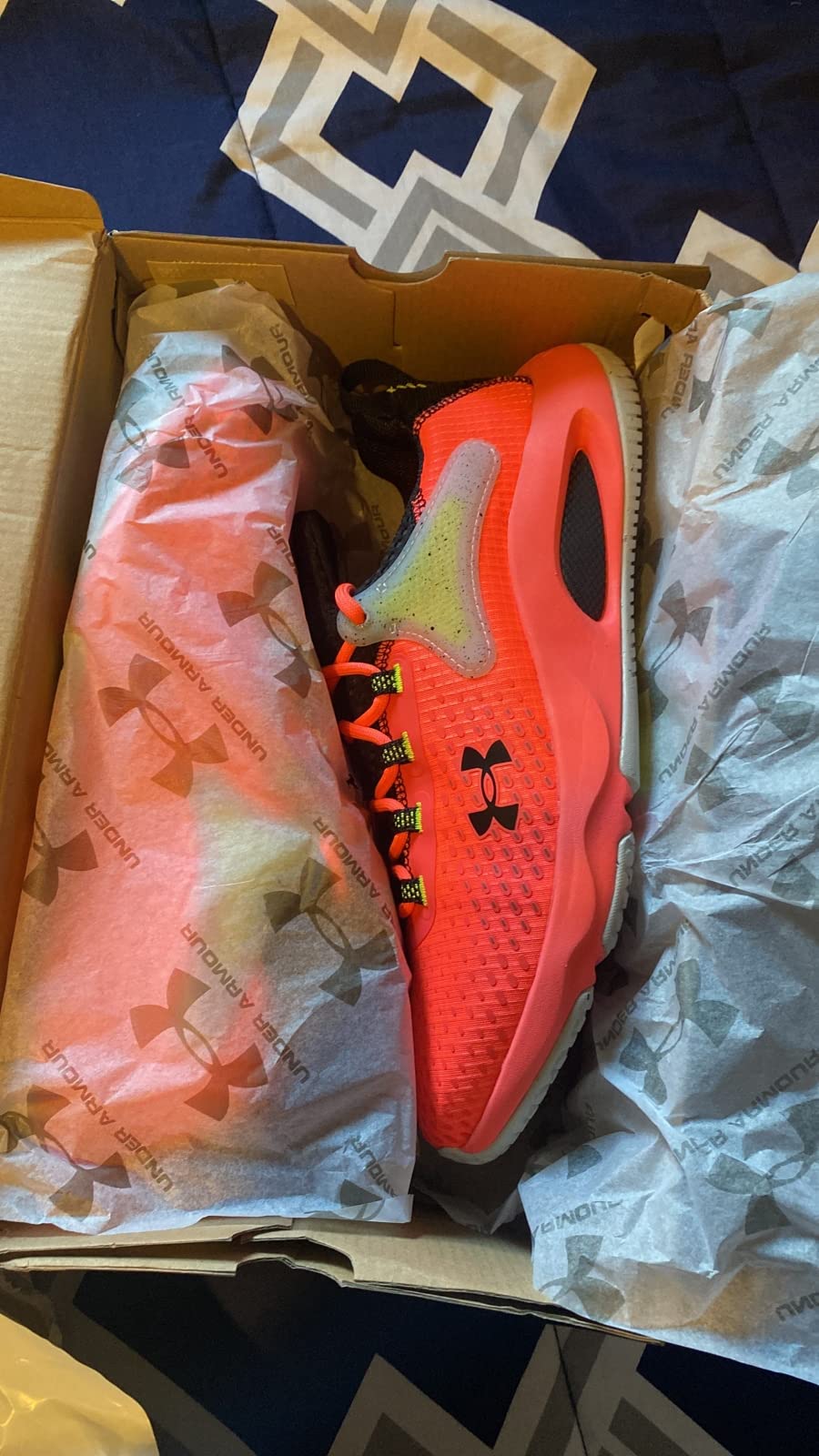 Under Armour HOVR Rise 4 design details showing mesh upper and lateral support structure